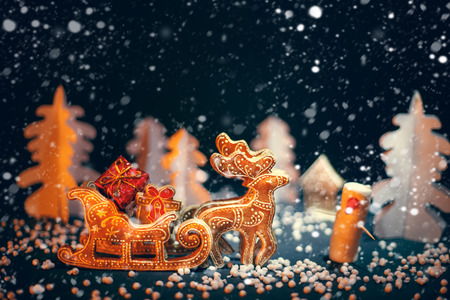 Christmas reindeer driven gifts in a snow-covered forest. Blizzard.の写真素材