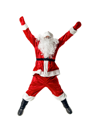 Joyful Santa Claus jumping and waving his arms. Isolated on white.の写真素材