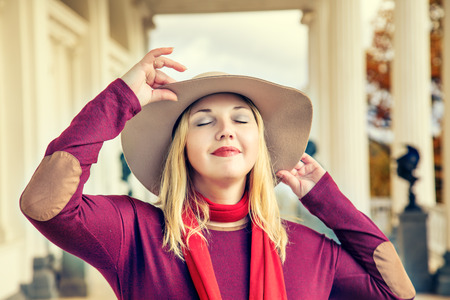 Portrait of beautiful stylish woman in a wide-brimmed hat.の写真素材