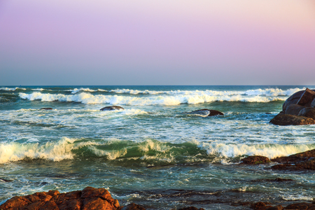 Magnificent seascape. Waves of the Indian Ocean are broken against stones.の写真素材