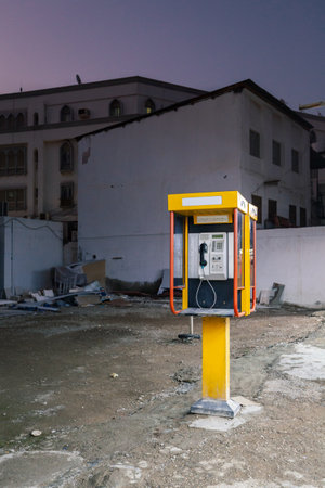 Yellow telephone booth at dusk, Muscat, Omanの写真素材