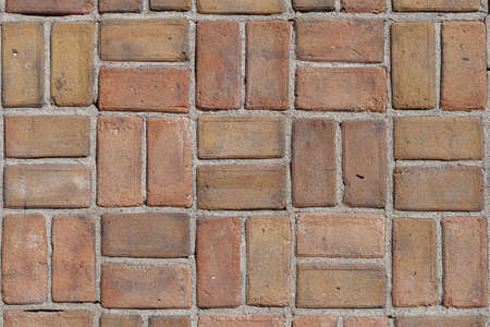 Brick wall background with bricks in a square shape pattern, space for text