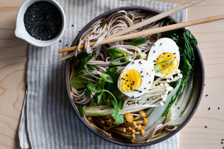 Side view of Japanese ramen soup with boiled egg on white marble background , copyspaceの写真素材