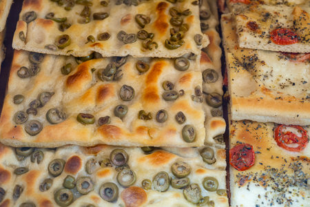 Freshly baked focaccia bread in a shop window in Genoaの写真素材