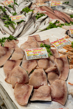 Fresh swordfish (pesce spada) for sale at a fishmonger in Genoa, Italy with priceの写真素材