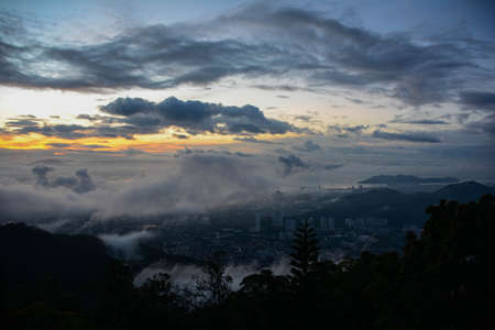 An early morning suburbs view of George Town, Penang, Malaysia, with clouds drifting byの写真素材