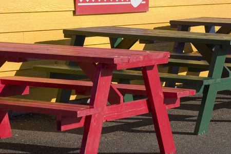 Colorful picnic benches at the harbor cafeの写真素材