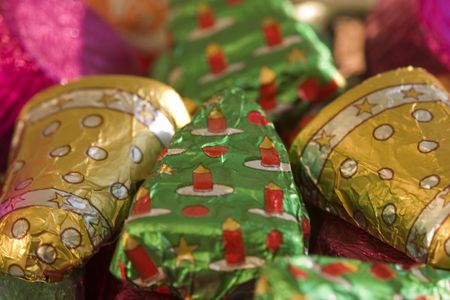 Tasty chocolates in pretty Christmas wrappersの写真素材
