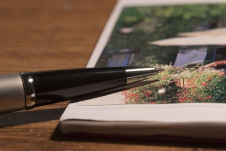 Stylish pen and a photo scrapbookの写真素材