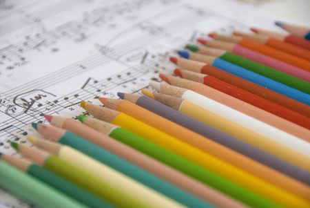 color pencils and music scoresの写真素材