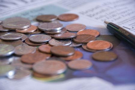 money, pen and newspaperの写真素材