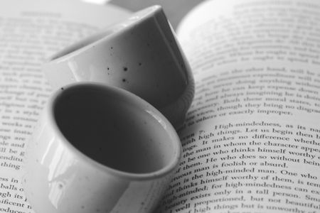 two sake cups and a novel in black and whiteの写真素材
