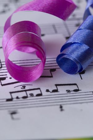 curly birthday ribbons and music scoreの写真素材