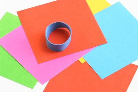 assorted colored papers and a rubber bandの写真素材