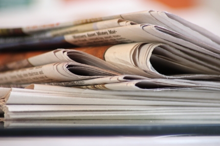 stack of morning newspapers