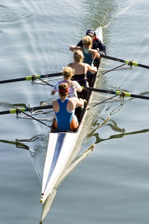 women varsity canoe team hard at workのeditorial素材