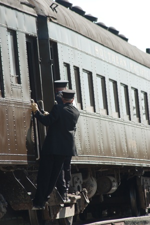Two train conductors and an railcarのeditorial素材