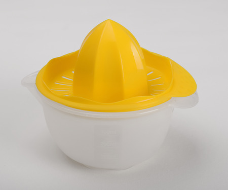 Plastic lemon-squeezer isolated on white backgroundの写真素材