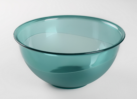 Green  transparent plastic deep dish, isolated on white backgroundの写真素材
