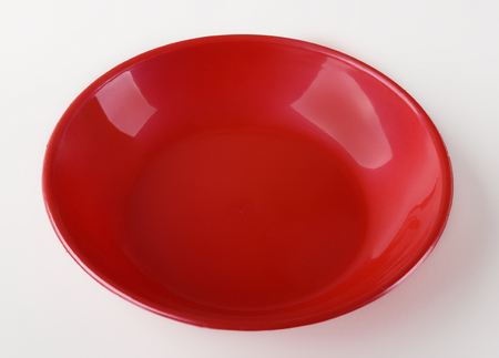 Red plastic shallow dish foodの写真素材