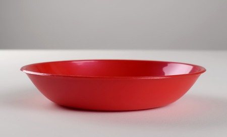 Red plastic shallow dish foodの写真素材