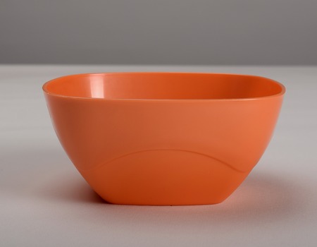 Orange plastic deep dishの写真素材