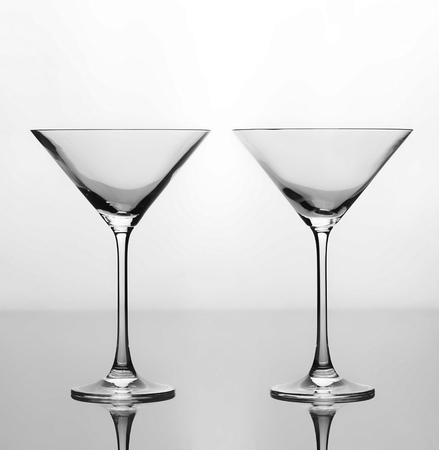 Set of two empty glasses martini isolated on white backgroundの写真素材