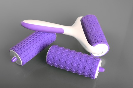 Pattern embosser with handle on gray backgroundの写真素材