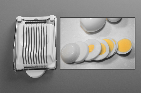 Egg slicer on gray backgroundの写真素材