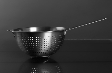 Empty sieve strainer stainless metal with handle. Front viewの写真素材