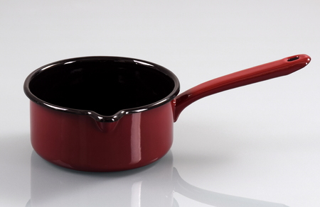 Enameled pan with handle, isolated on white backgroundの写真素材