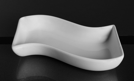 White porcelain bowl with waveform for snacksの写真素材