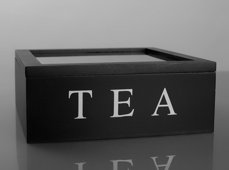 Wooden black box for tea with glass lidの写真素材