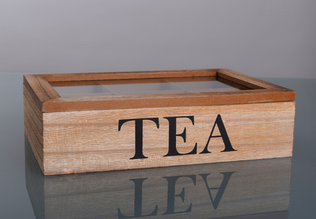Wooden box for tea with six compartments and glass lidの写真素材