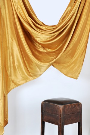 Scene in modern studio with chair and satin curtains on white backgroundの写真素材