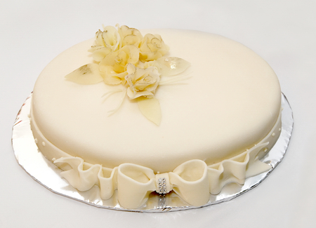 Wedding cake with yellow decorationsの写真素材