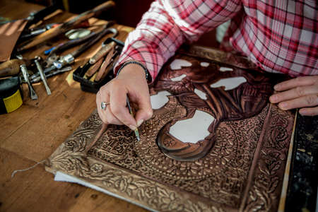 Designing copper utensils, the age old art of crafting copper wares. Master craftsman making copper...