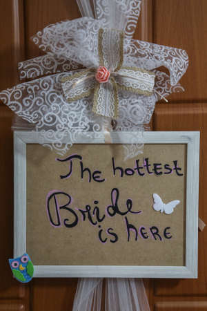 THE HOTTEST BRIDE IS HERE, an inscription written on the bride's door on the wedding dayの写真素材