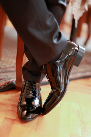 Business man or groom with classic lace elegant shoes. Shoes for business clothing, men's style.の写真素材