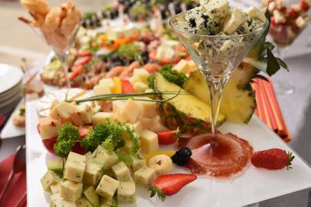 Selective focus. Chopped pieces of Gorgonzola served in a glass on the tableの写真素材