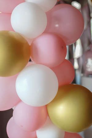Many colorful balloons decorated wall as background. Beautiful background with colorful balloons. Birthday style partyの写真素材