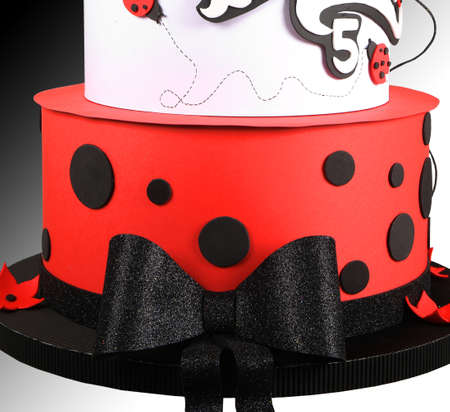 Modern wafer paper cakes. The cakes maked of wafer paper. Design cake in the form of ladybug on a white background. Birthday cakeの写真素材