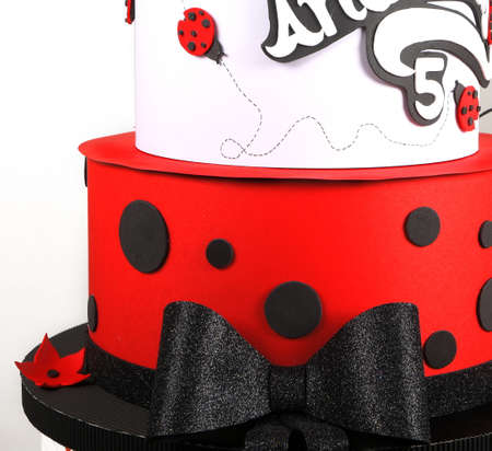 Modern wafer paper cakes. The cakes maked of wafer paper. Design cake in the form of ladybug on a white background. Birthday cakeの写真素材