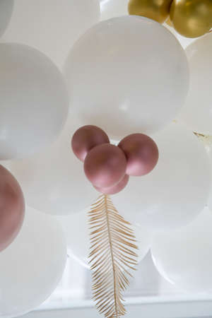 Many colorful balloons decorated wall as background. Beautiful background with colorful balloons. Birthday style partyの写真素材