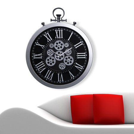 A large round indoor clock on the wall. Big clock on metal rack. Big clock hanging on white wall. Time concept. Antique clock hanging on the living room wallの写真素材