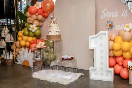 Happy Birthday! Children's decoration with glowing lights, birthday garland, different color of balloons. Decorated photo zone. Festive decorative elements, photo areaの写真素材