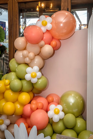 Happy Birthday! Children's decoration with glowing lights, birthday garland, different color of balloons. Decorated photo zone. Festive decorative elements, photo areaの写真素材