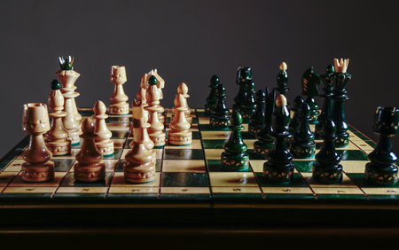 Chess board game concept of business ideas and competition and strategy ideas concept. Chess pieces before the game. Chess board on the table. View with chess pieces on a chess tabの写真素材
