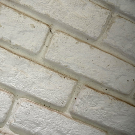 Detail of white old brick wall texture background. White urban wallpaper interior. Beautiful background of a white brick wallの写真素材