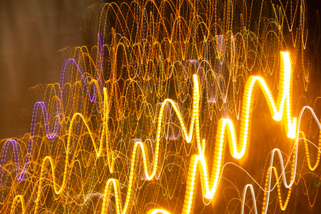 Abstract motion blur of colorful lights on black background. Long exposure.
